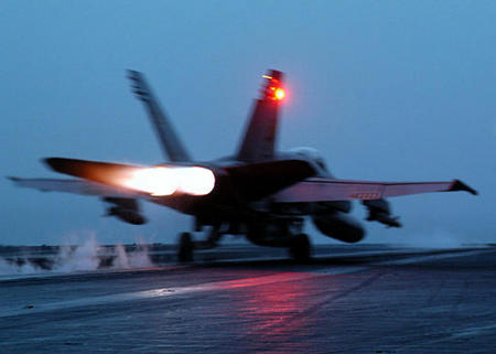 F/A-18 Hornet, launches from the flight deck of the USS Theodore Roosevelt, Mediterranean Sea, April 5, 2003.